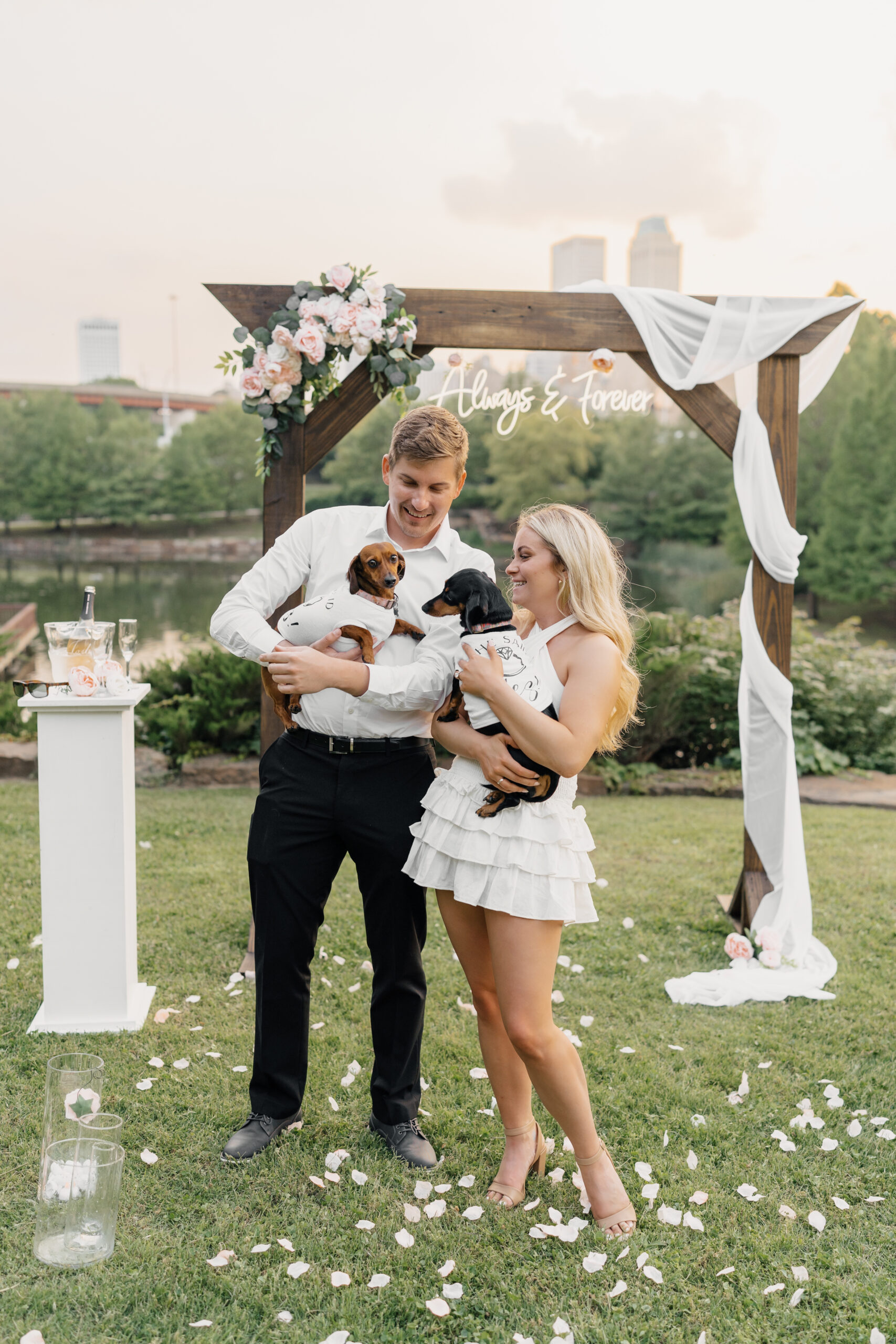 Emotional proposal moment at Centennial Park overlooking downtown Tulsa