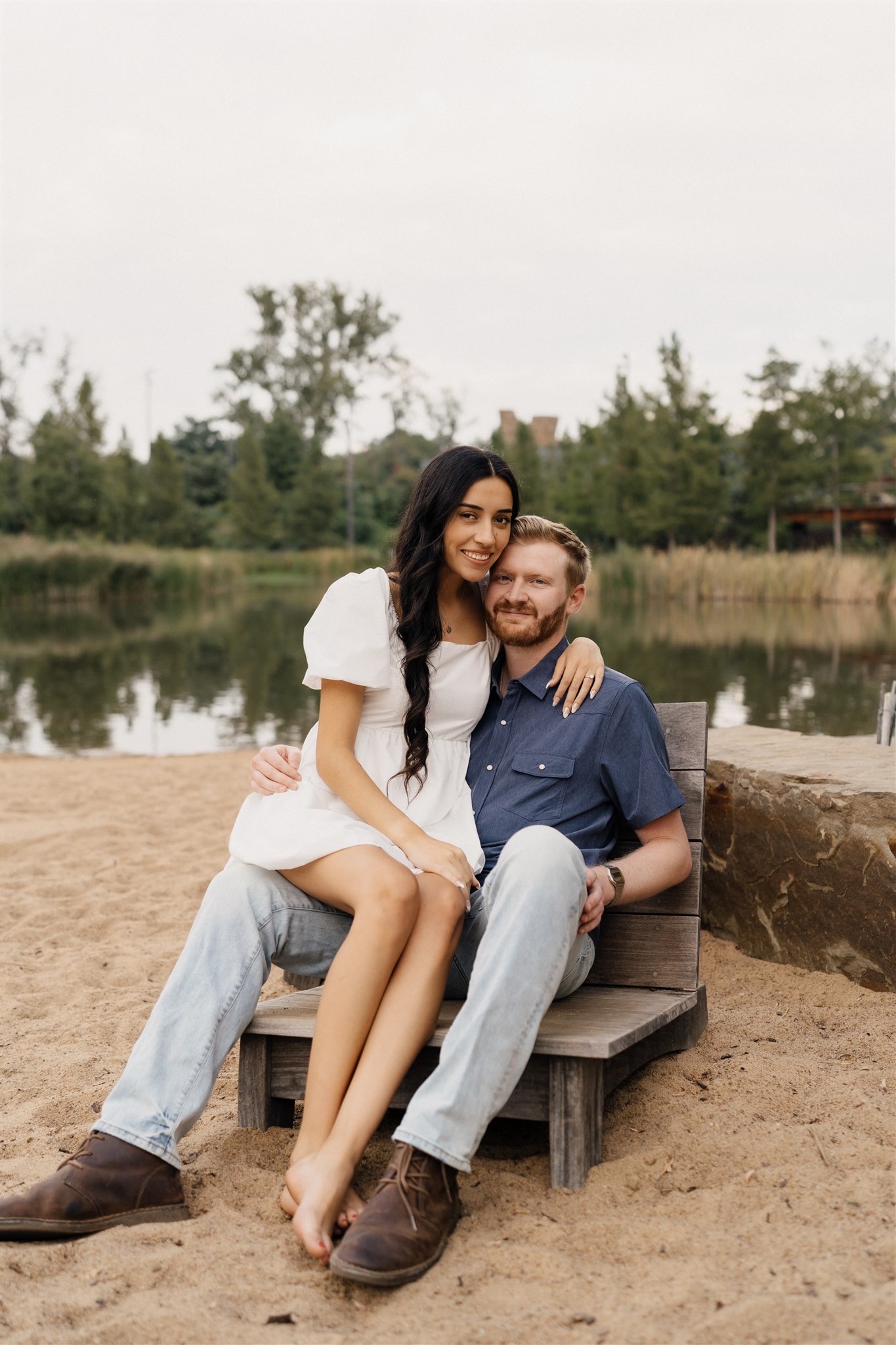 Intimate engagement photos in front of the Willow Tree in Tulsa gardens.