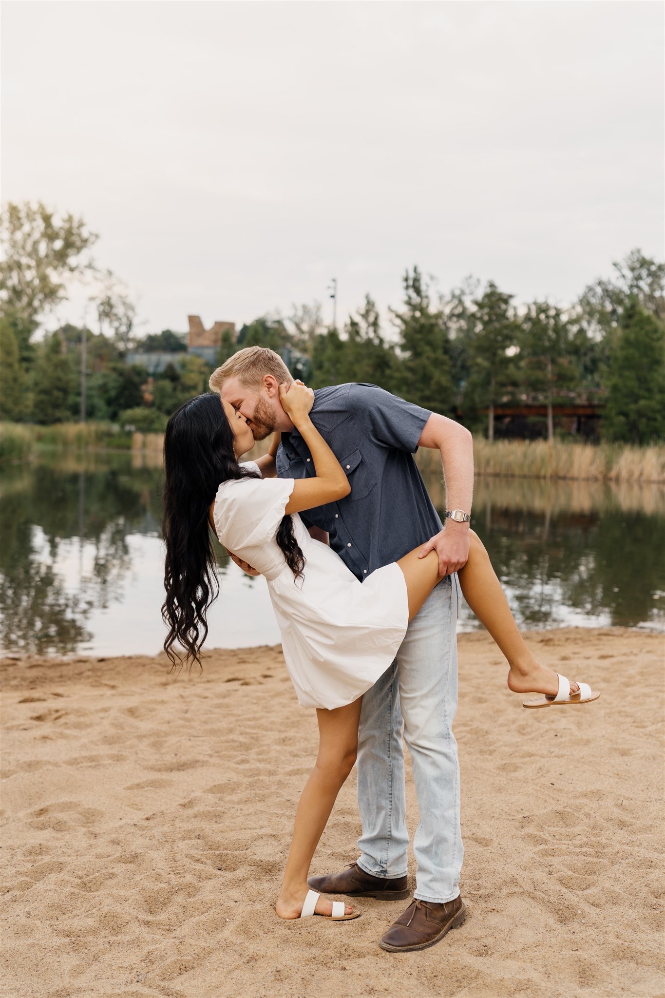 Romantic couple portraits beneath the iconic Willow Tree during Tulsa engagement session.