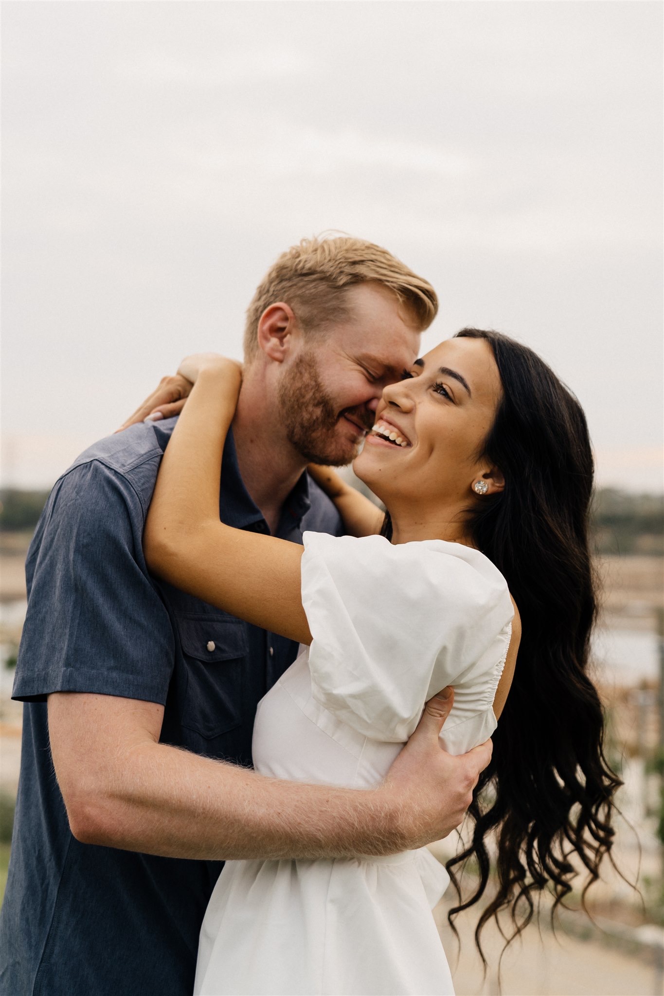 Intimate couple portraits in Gathering Place Tulsa gardens during engagement session.