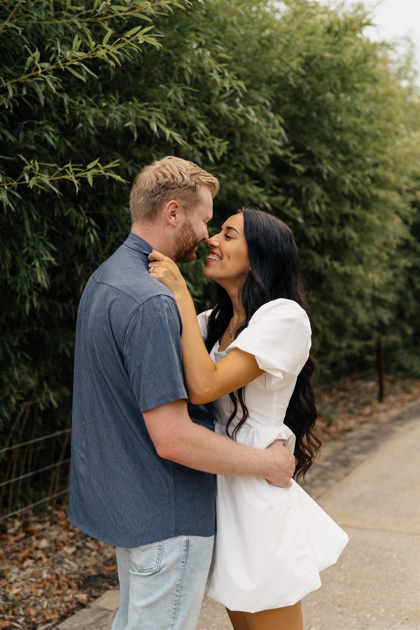 Sunlit engagement portraits in the outdoor spaces of Gathering Place Tulsa, Oklahoma.