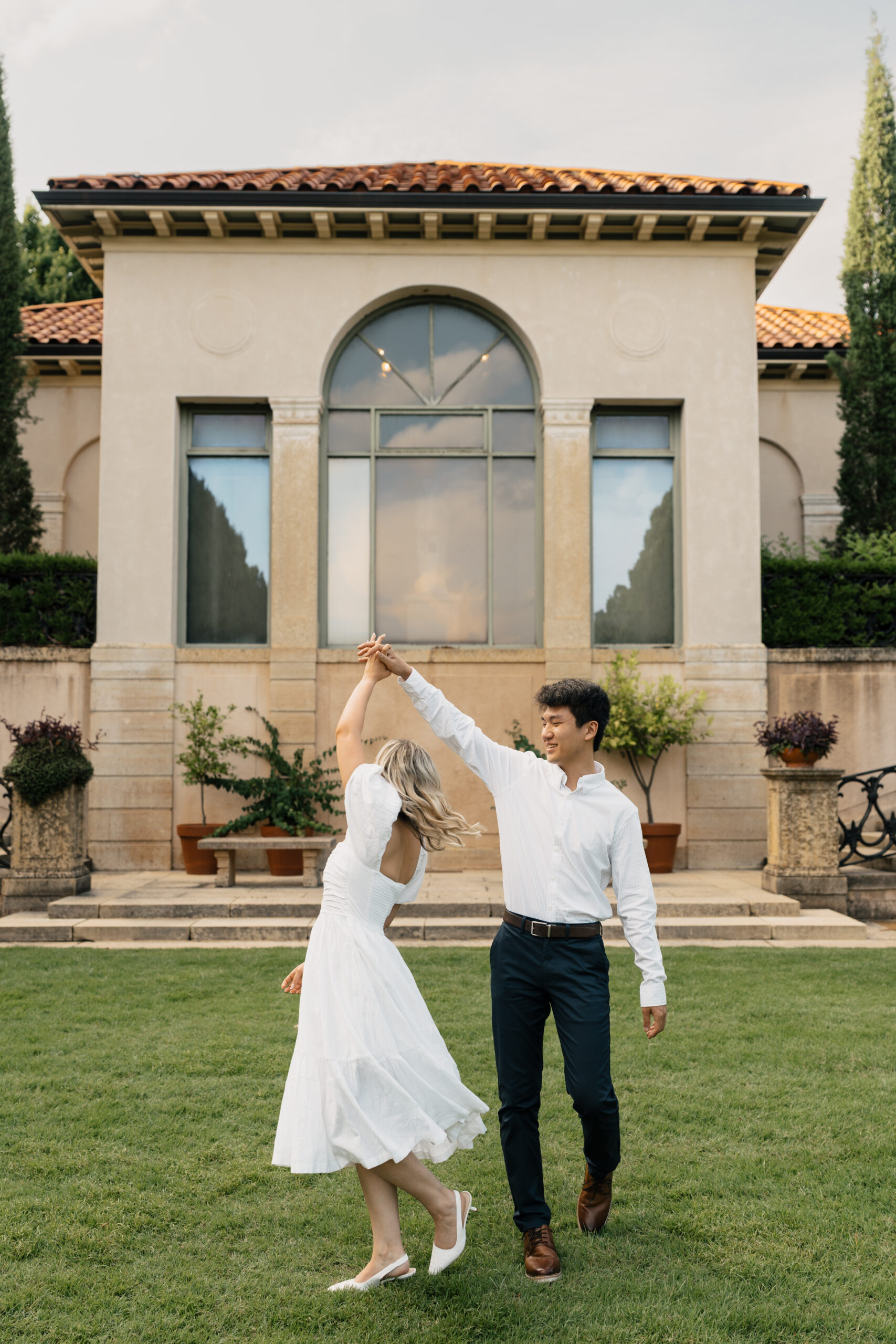 Elegant engagement session at the Philbrook Museum with classic European-inspired architecture