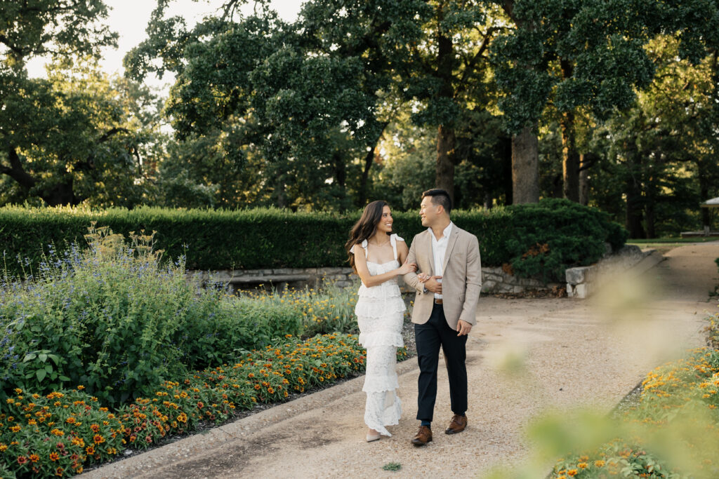 Couple walking through the gardens of The Mansion at Woodward Park