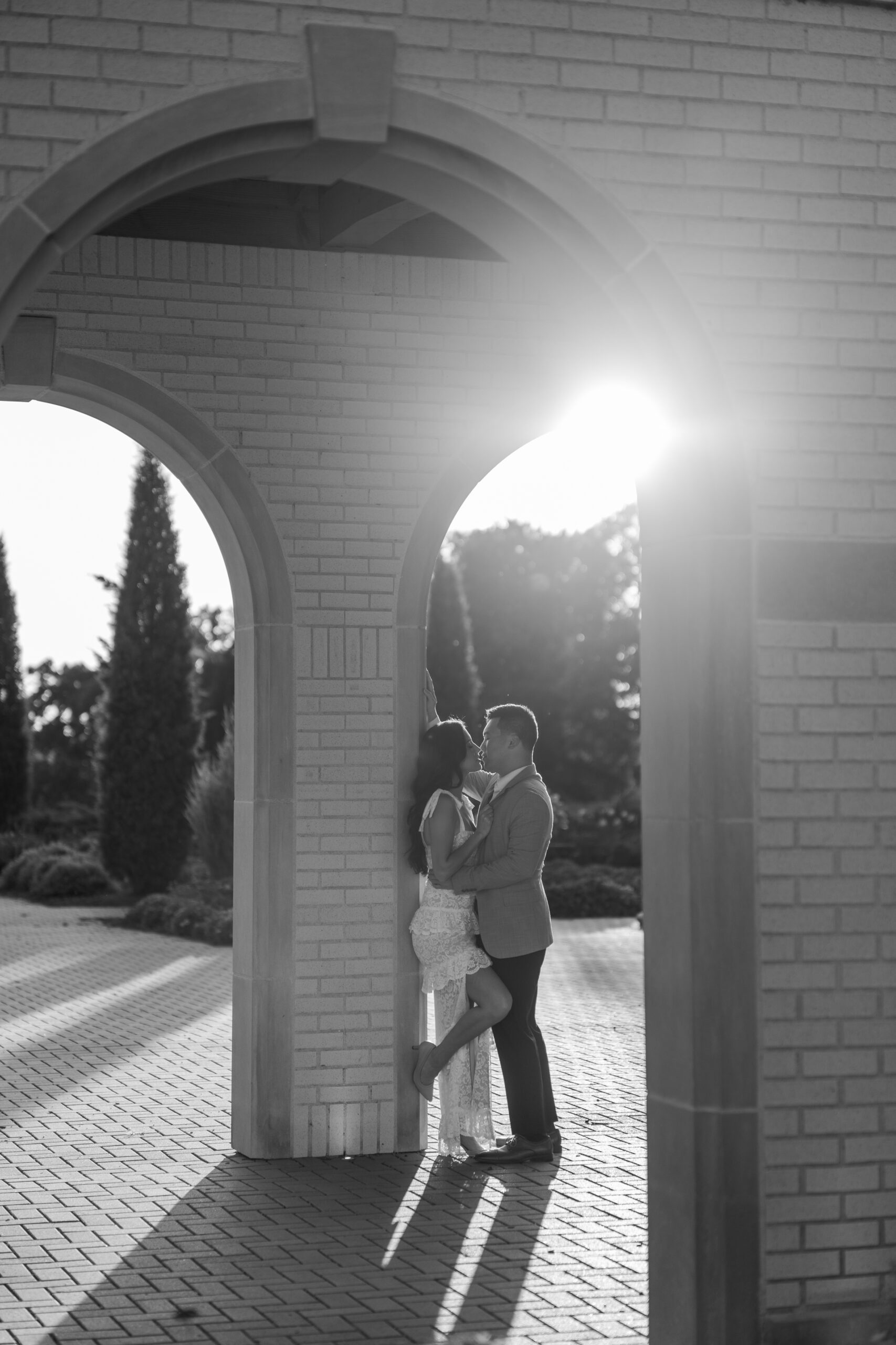 Couple posing for Tulsa engagement photos at the Rose Garden
