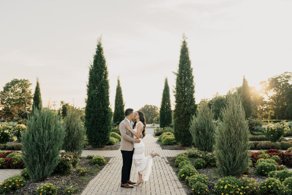 Golden hour engagement portraits with soft sunlight filtering through trees at Woodward Park