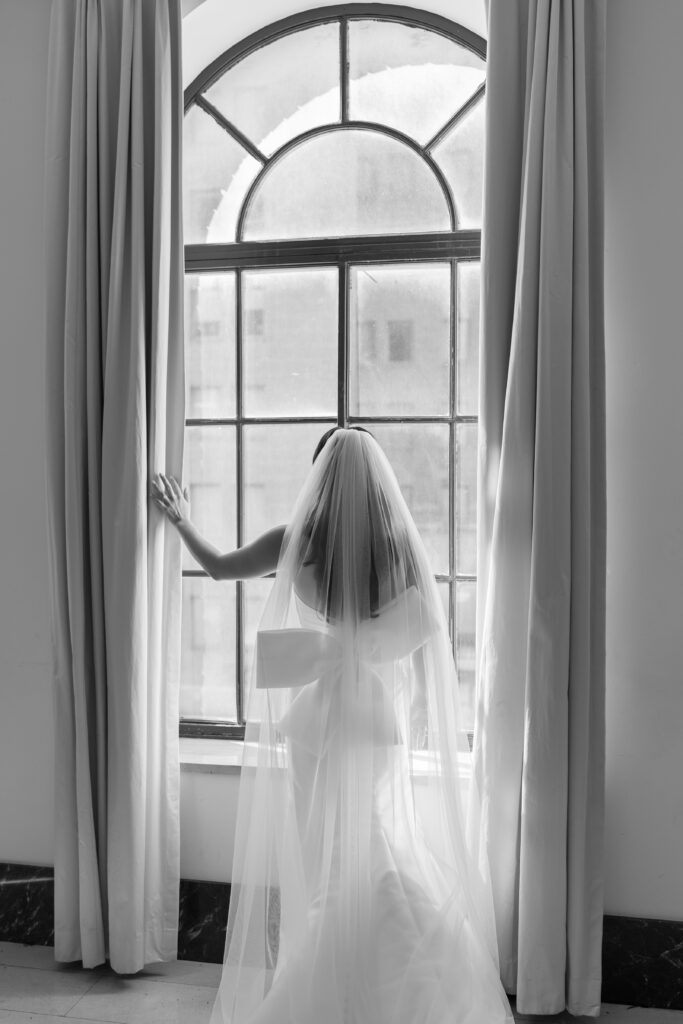 Behind-the-scenes photo of photographer shooting a couple outside