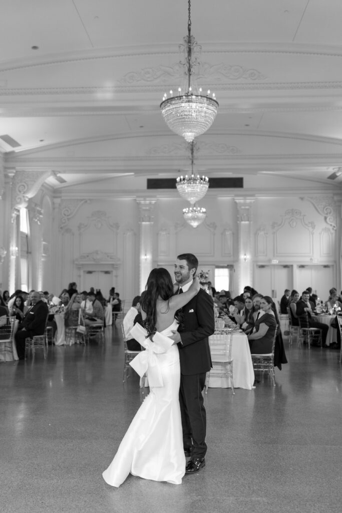 Photographer working on a laptop editing photos in Lightroom