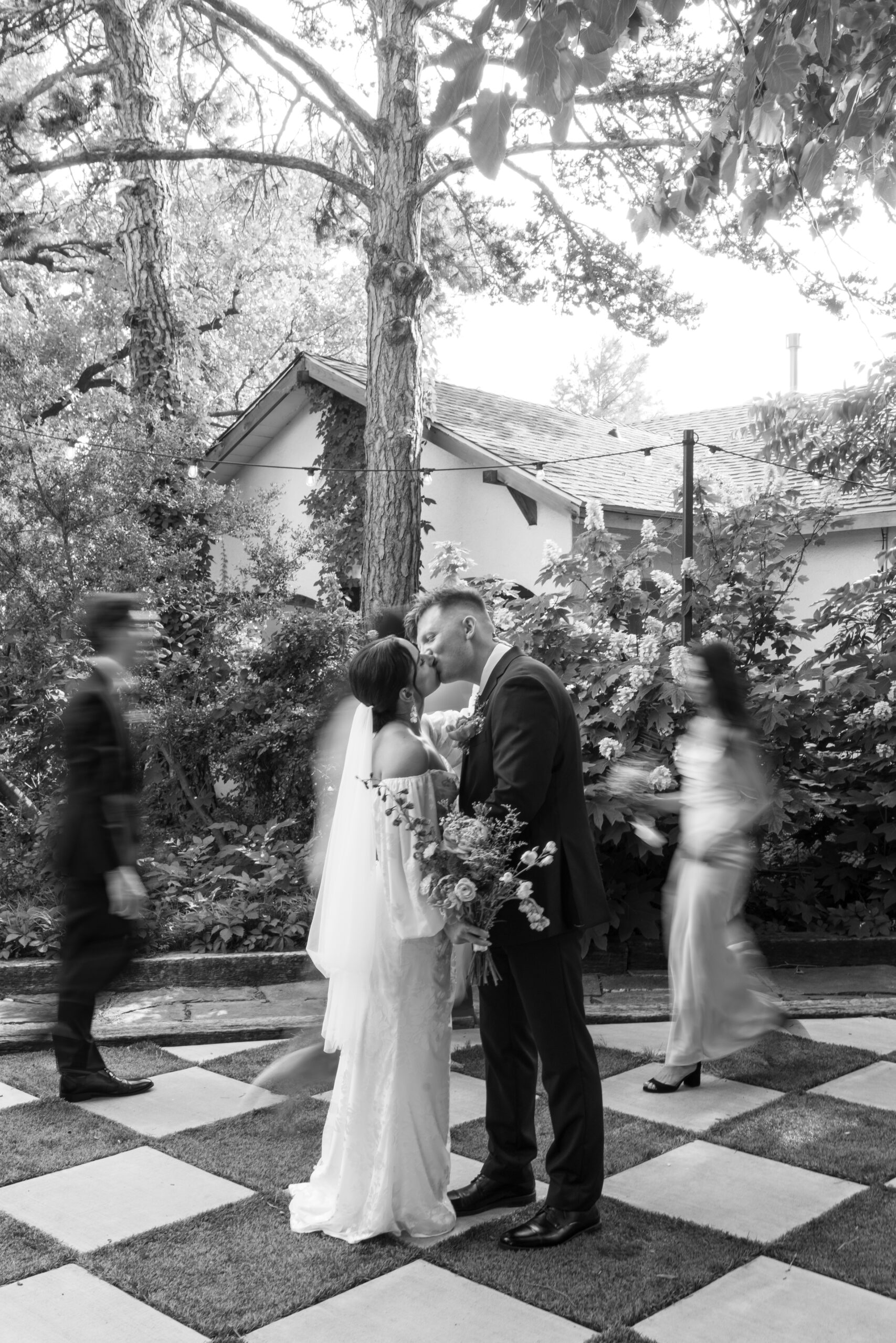 Newlyweds walking cobblestone streets during Italy destination wedding