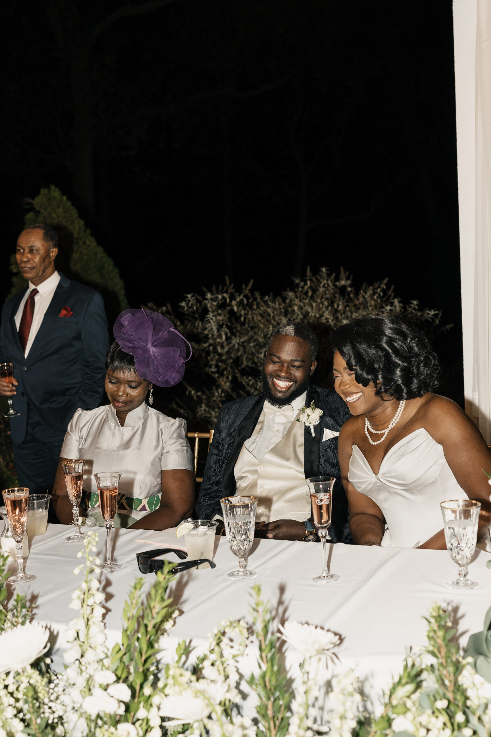 Bride laughing with guests during Haseltine Estate reception
