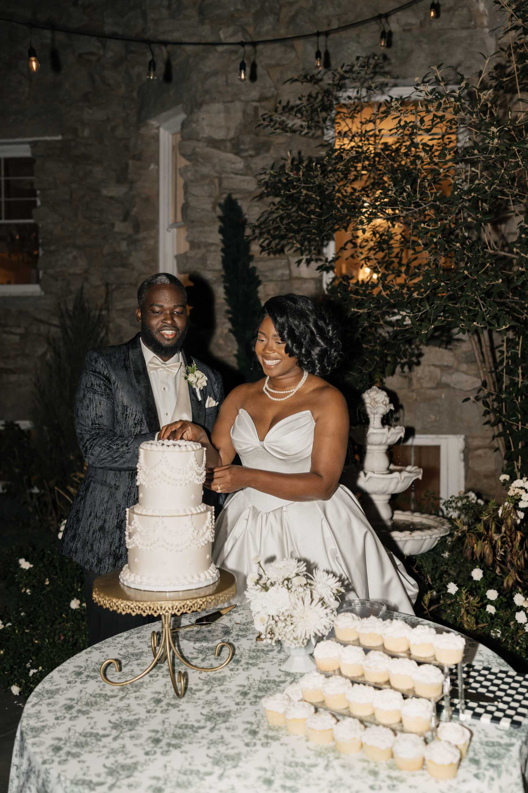 Al fresco wedding dinner under string lights at Italy-inspired wedding