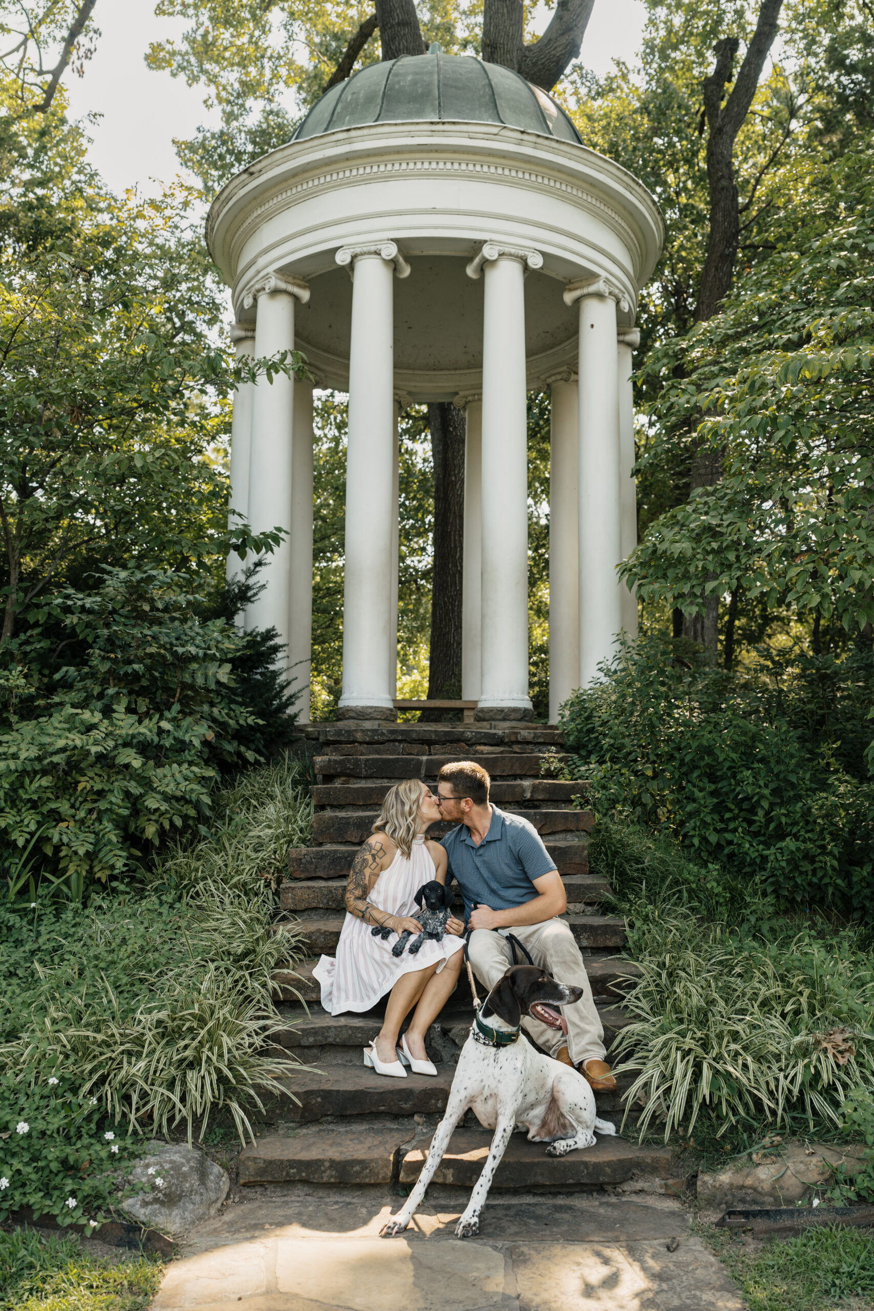 Intimate couples photos in Tulsa gardens at Philbrook Museum with historic architecture.