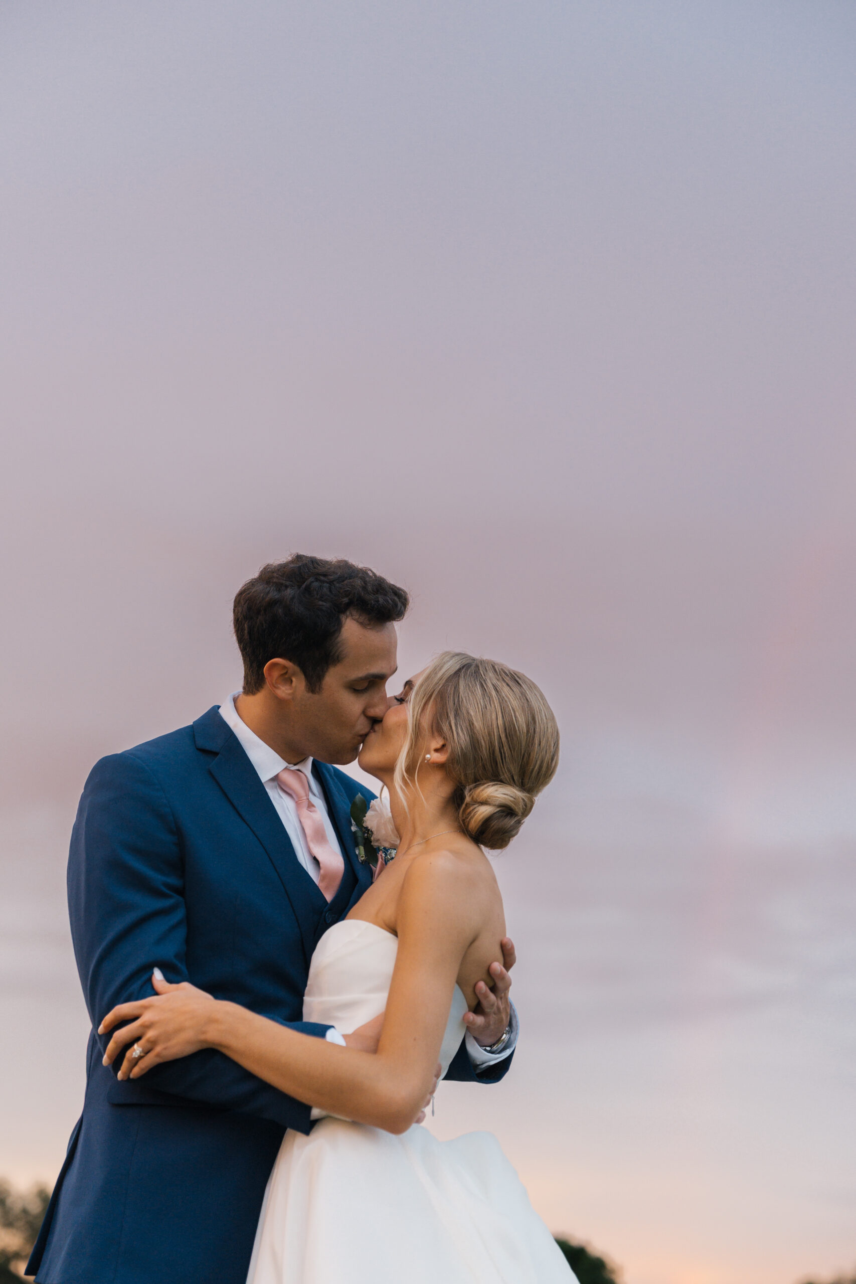 Bride and groom kissing wedding photography