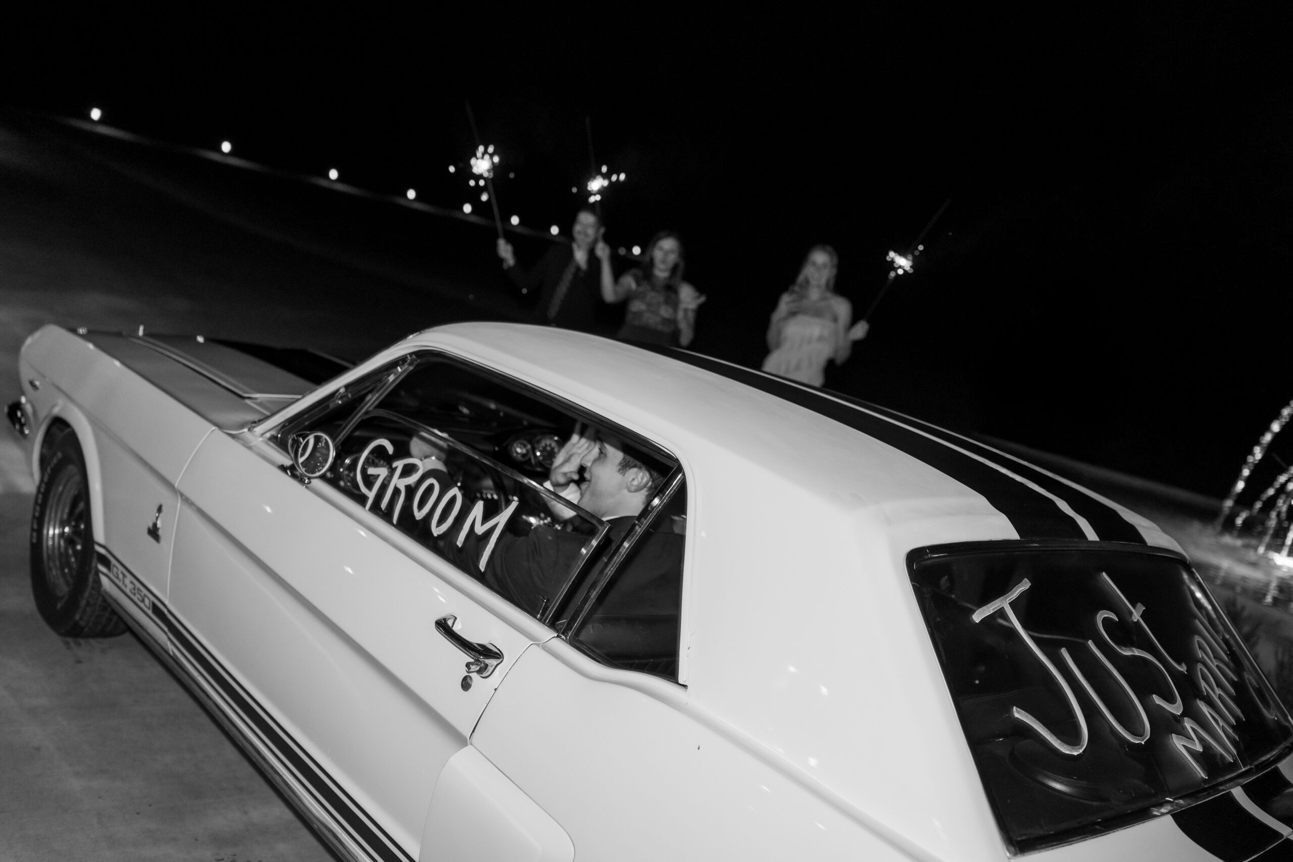 Driving off in a classic getaway car