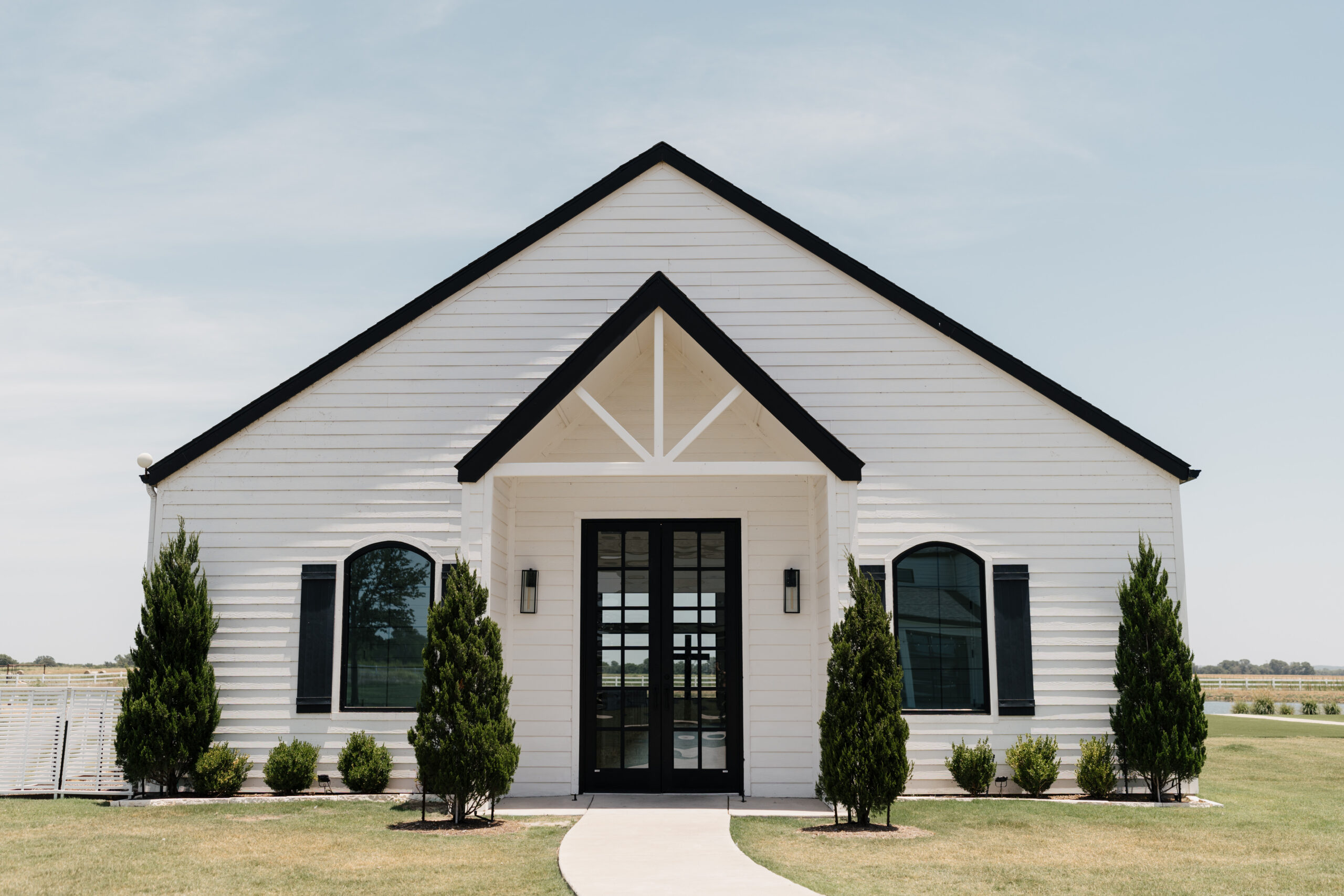 Front view of The Gardenia wedding venue  chapel in Valley View, Texas, showcasing its elegant white exterior and modern southern charm.