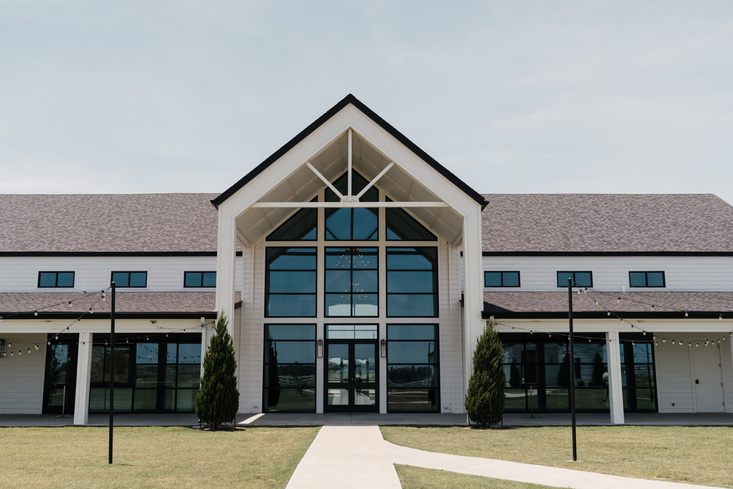 The Gardenia’s modern farmhouse-style architecture with clean lines and neutral tones.