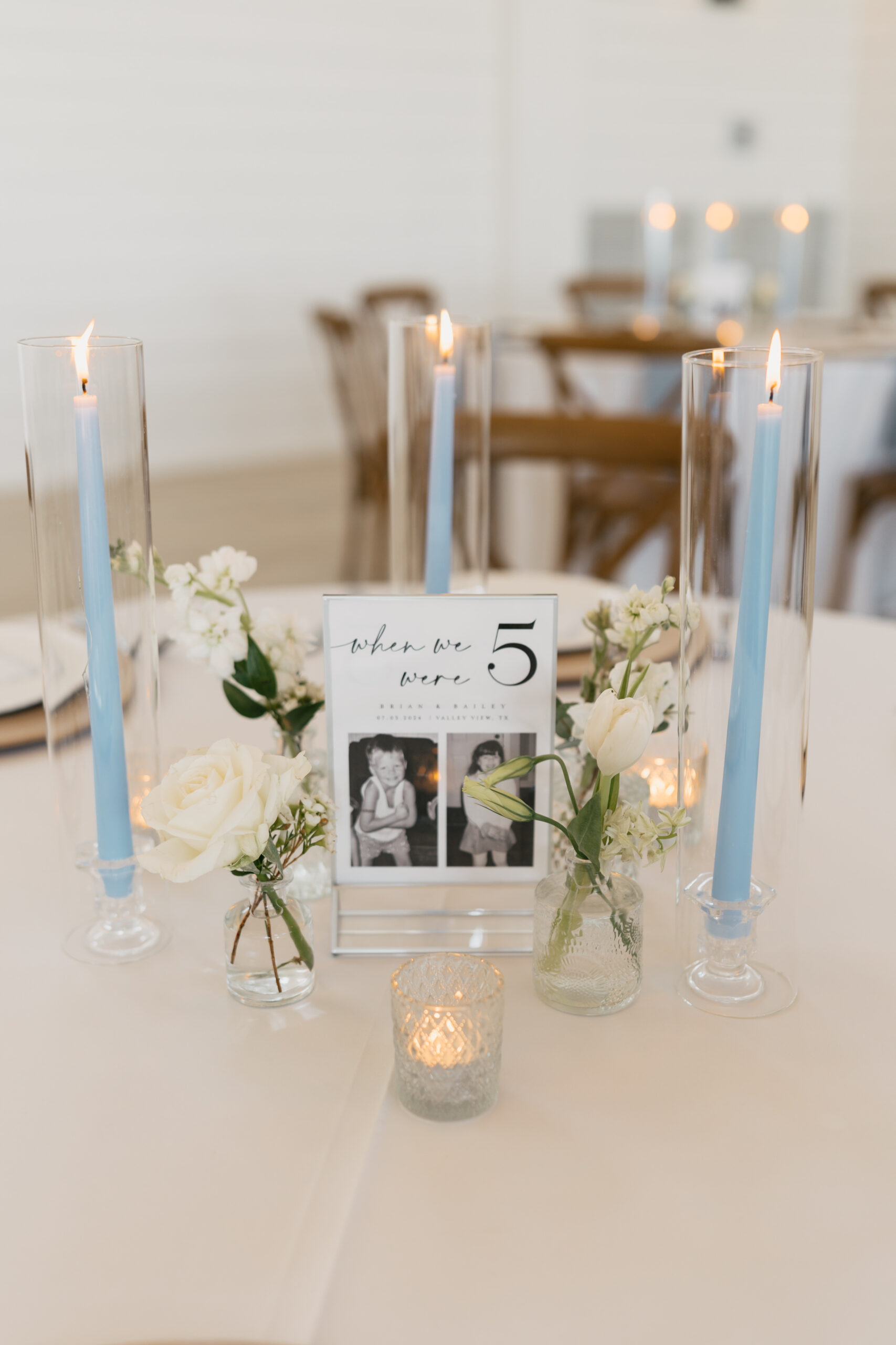 Romantic floral table arrangement and candles at The Gardenia wedding venue in Valley View, Texas.