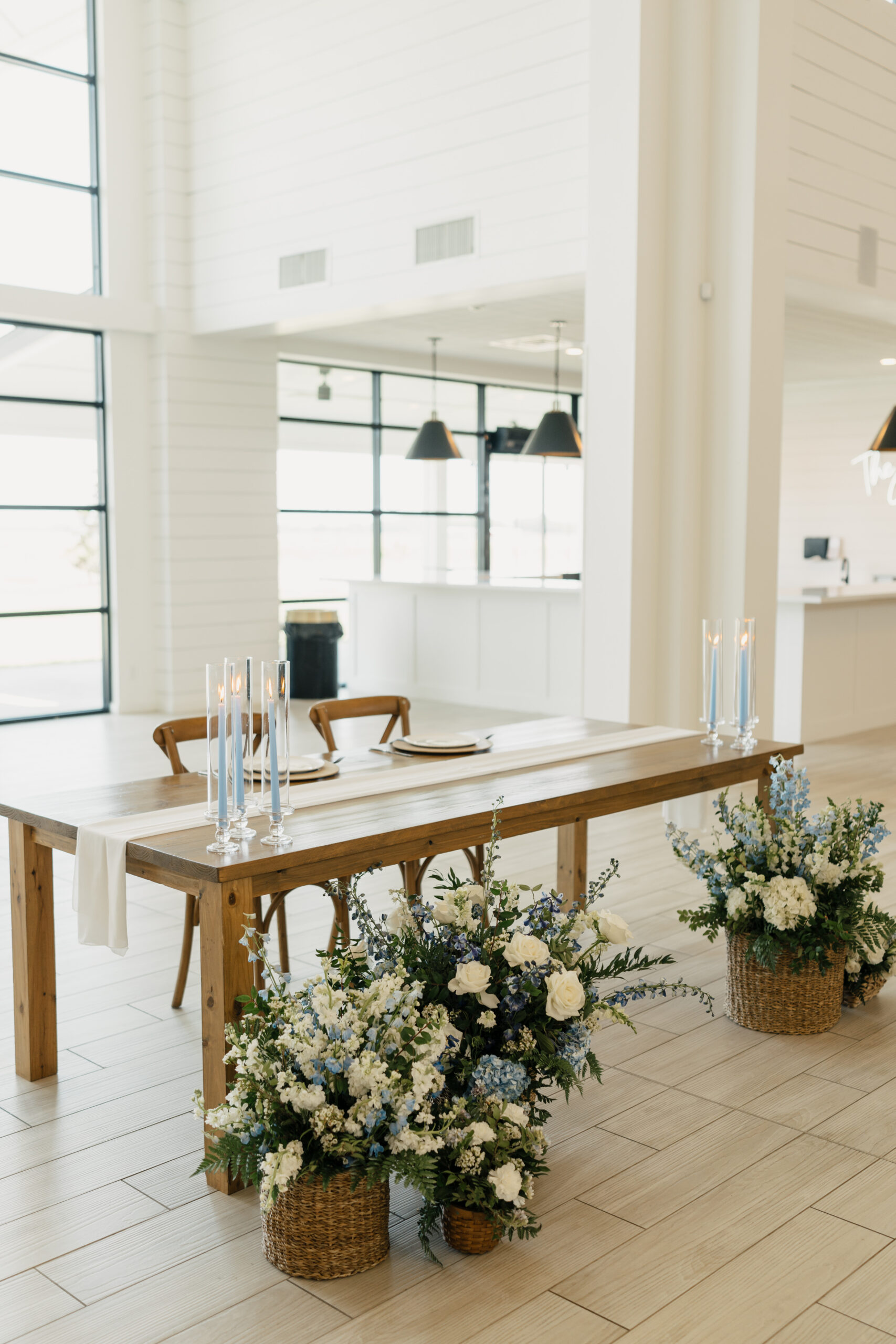 Minimalist wedding decor with greenery and candles at The Gardenia in Valley View, Texas.
