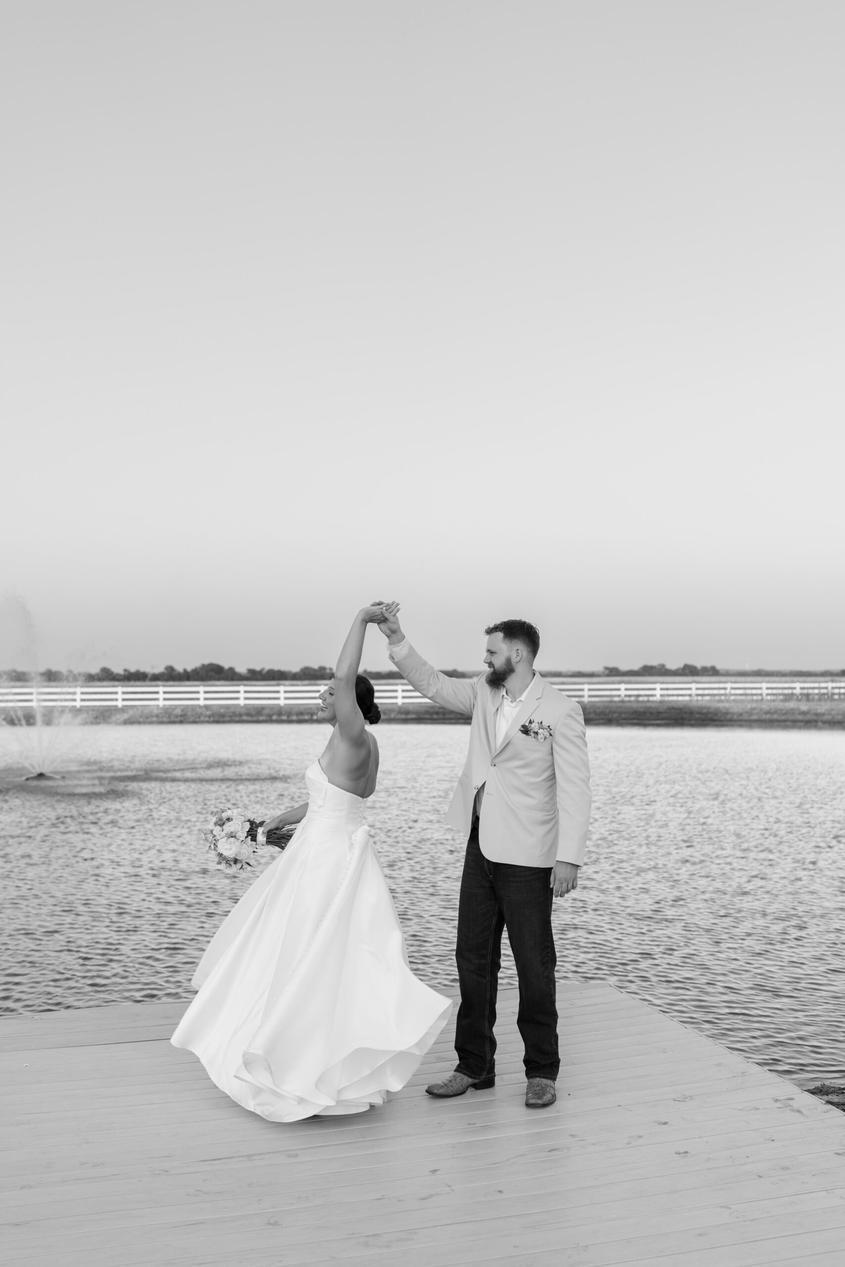 Bride twirling in her dress at sunset outside The Gardenia.