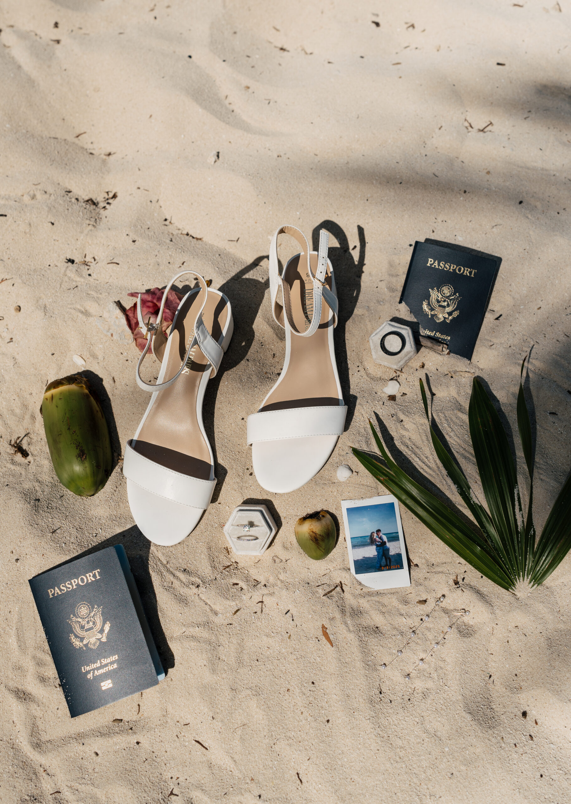 Wedding invitation suite styled on tropical beach sand