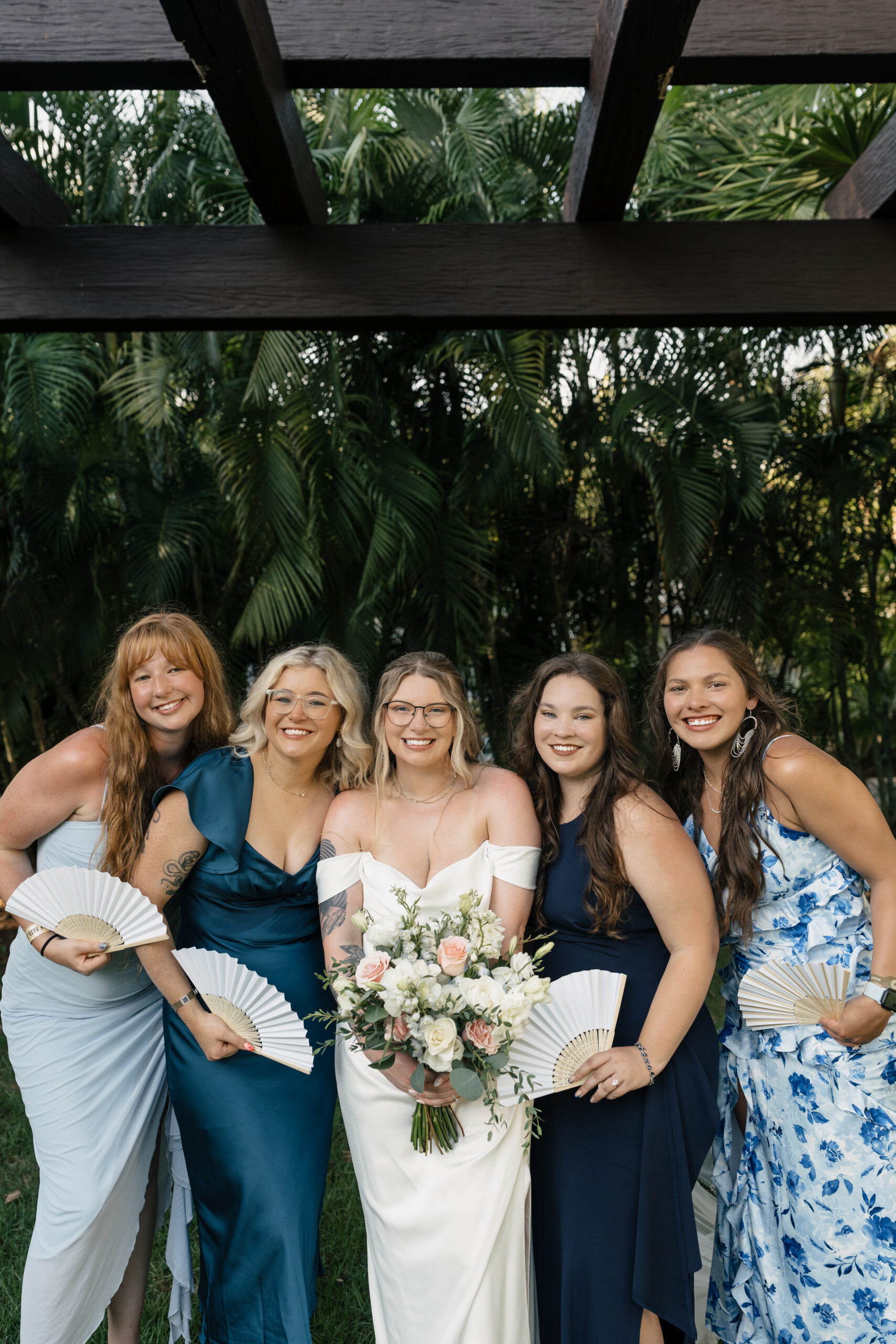 Bridesmaids in tropical dresses at Sandos Playacar Resort