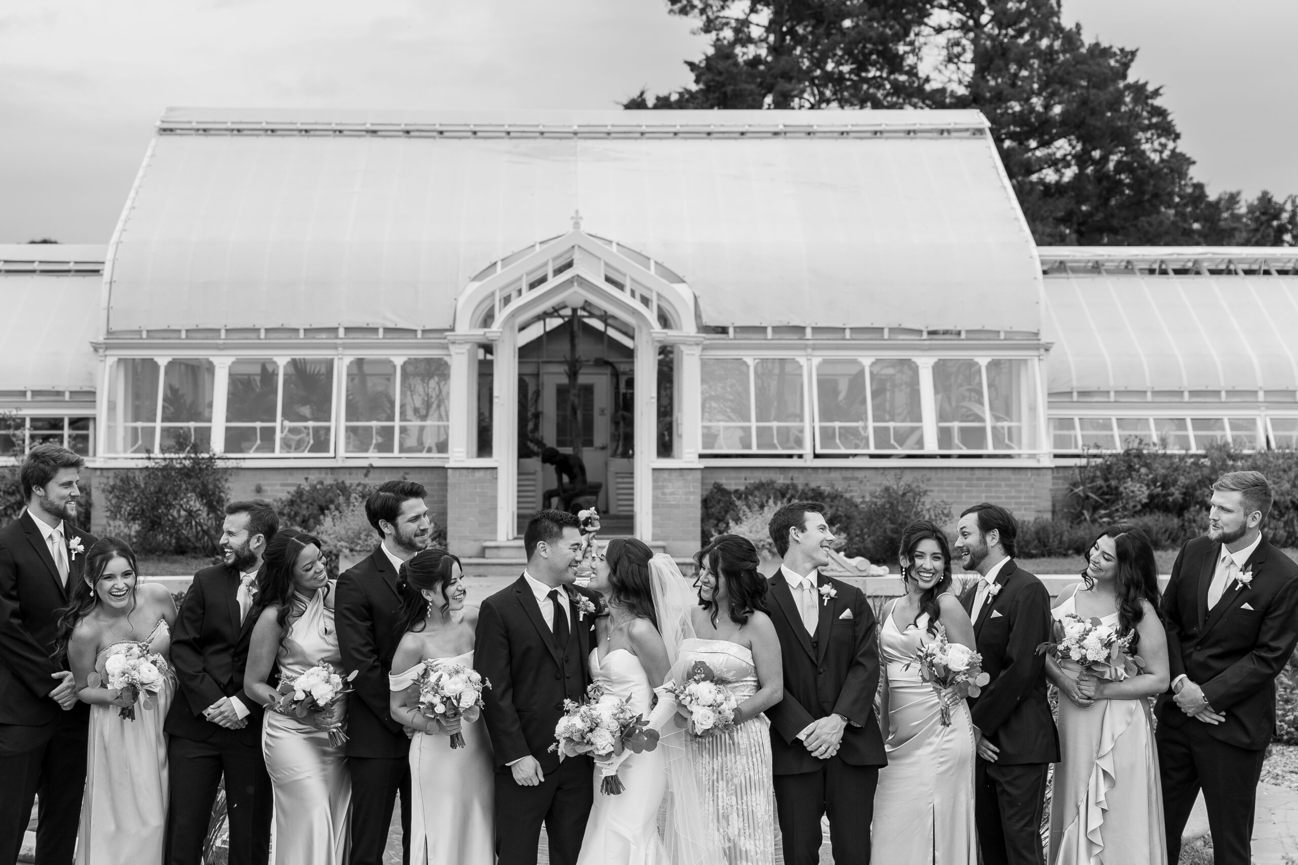 Wedding party celebrating outside the mansion