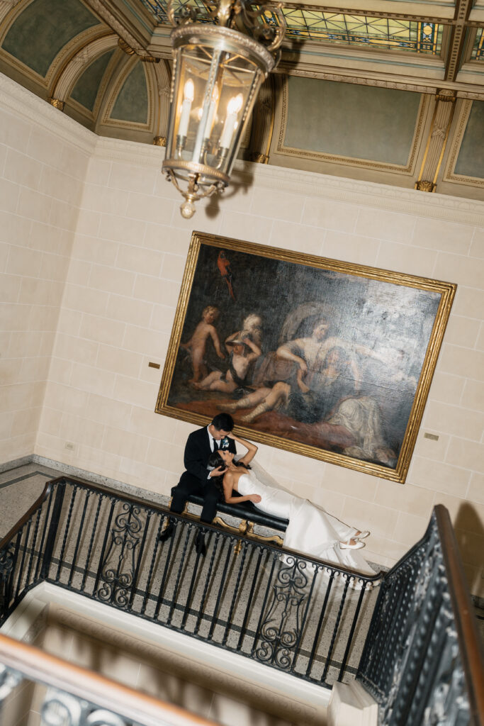Close-up of photographer using HoneyBook on a laptop to organize clients