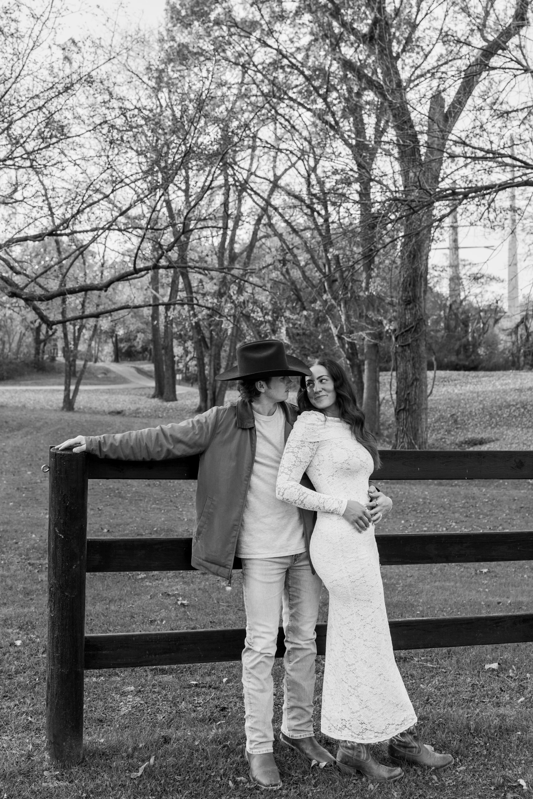 Couple leaning forehead-to-forehead in a romantic moment at Spain Ranch