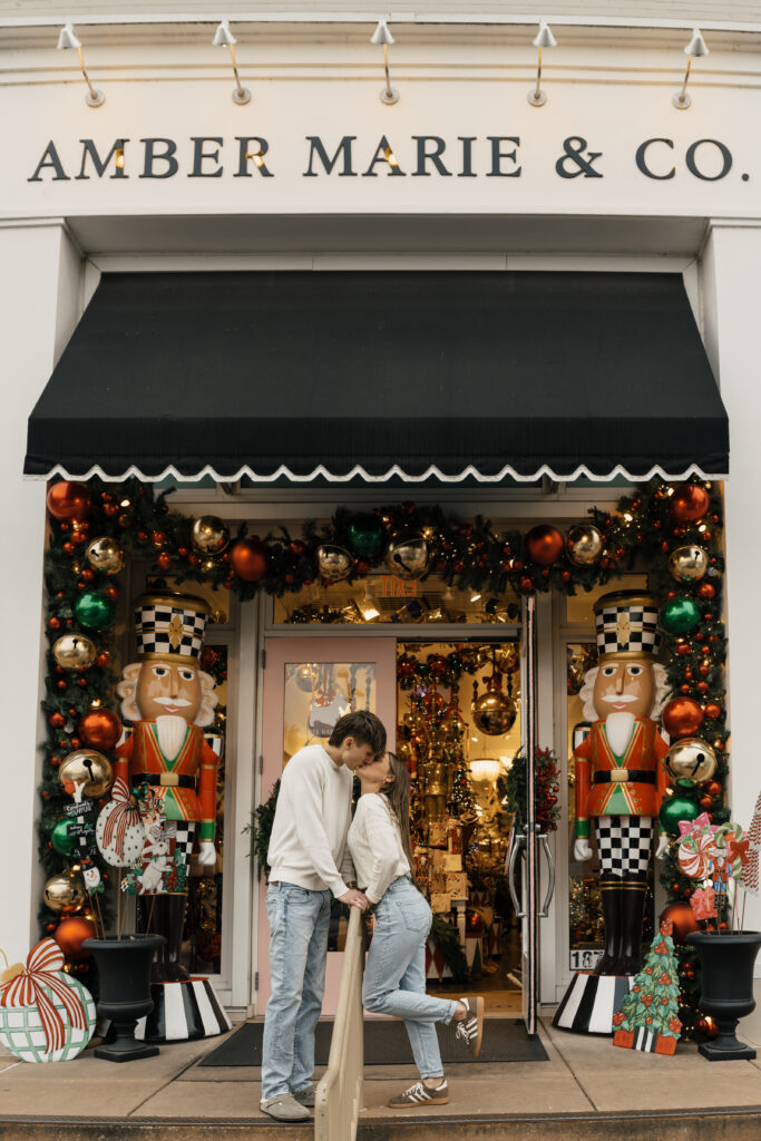 Couple standing outside festive Utica Square storefront