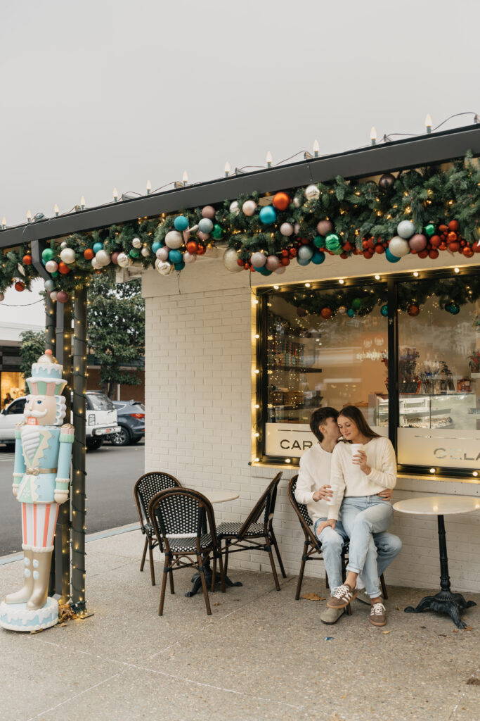 Couple sipping coffee during Christmas couple photoshoot in Tulsa