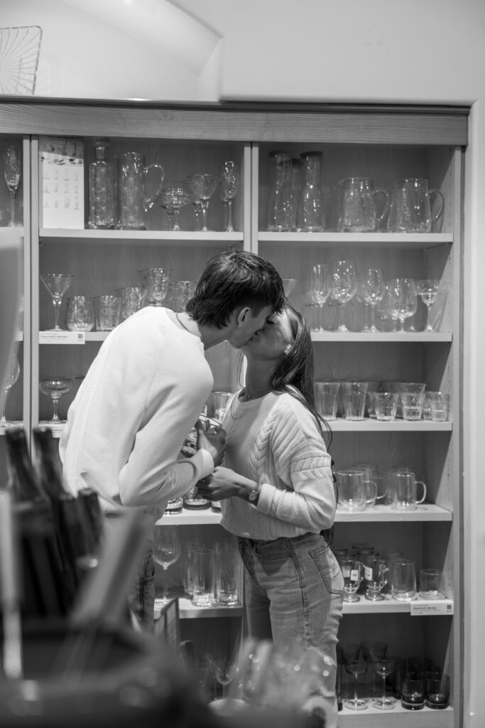 Couple holding hands while exploring Christmas stores in Utica Square