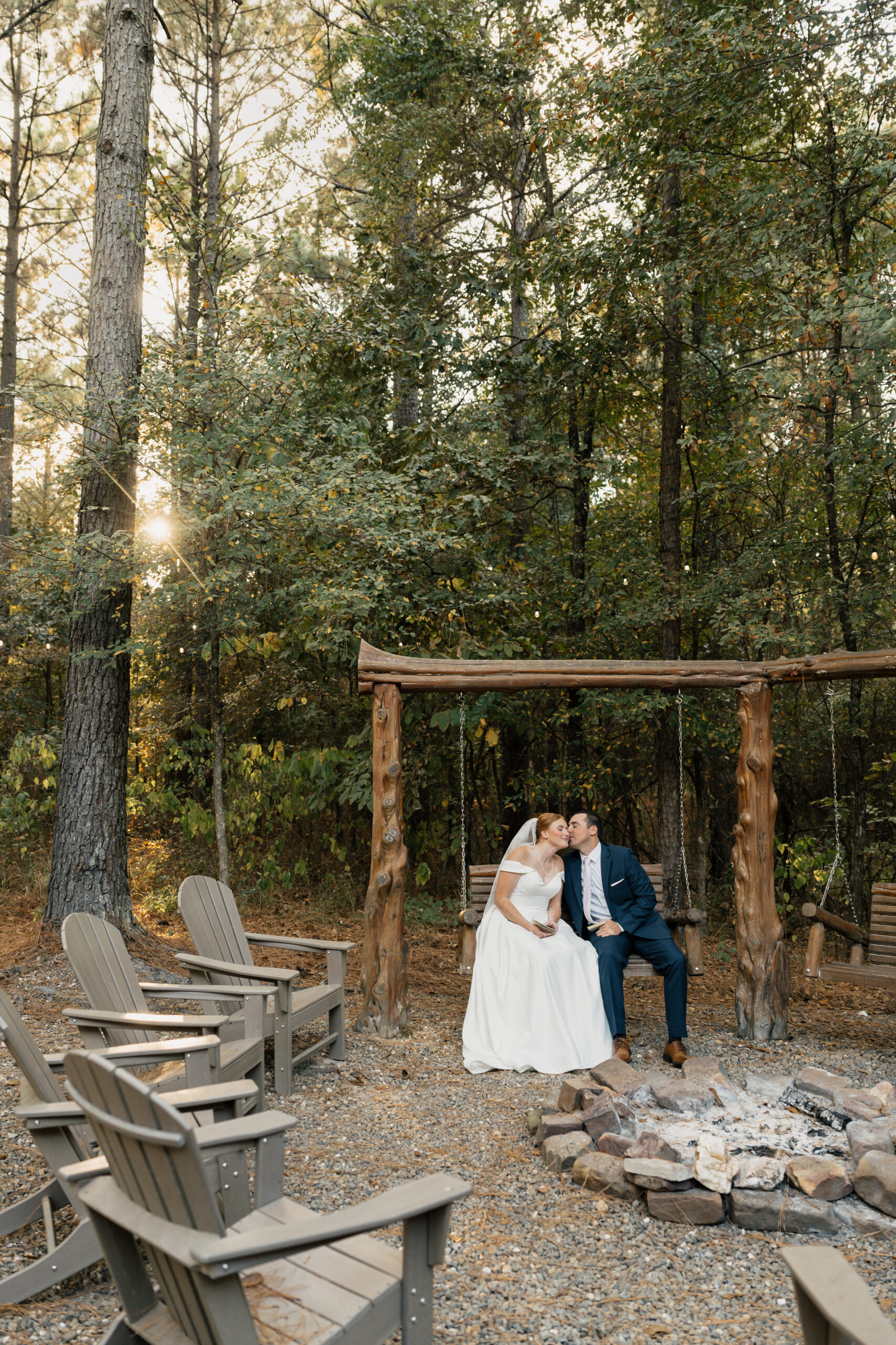 Couple during a Broken Bow elopement with lake and forest background